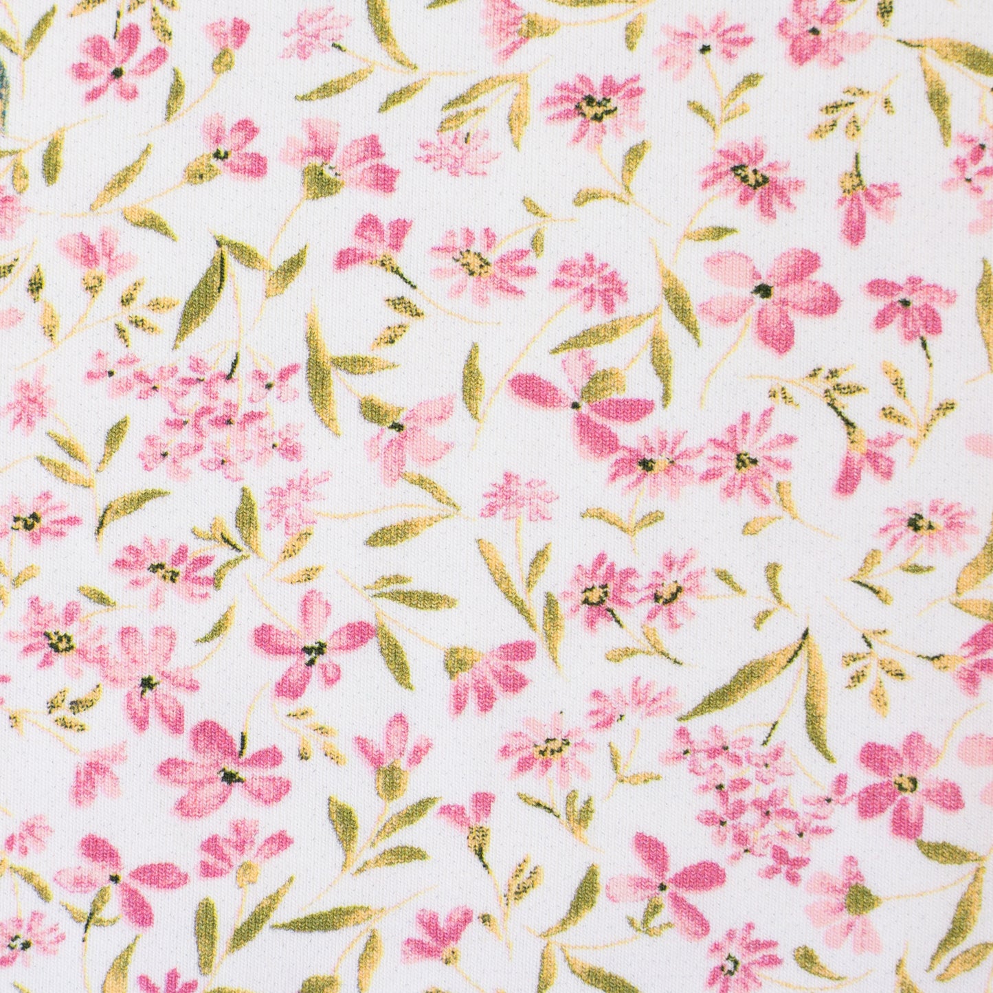 wunderschöner Bio Jersey Stoff mit kleinen zarten Blumenmotiven auf hellem Hintergrund