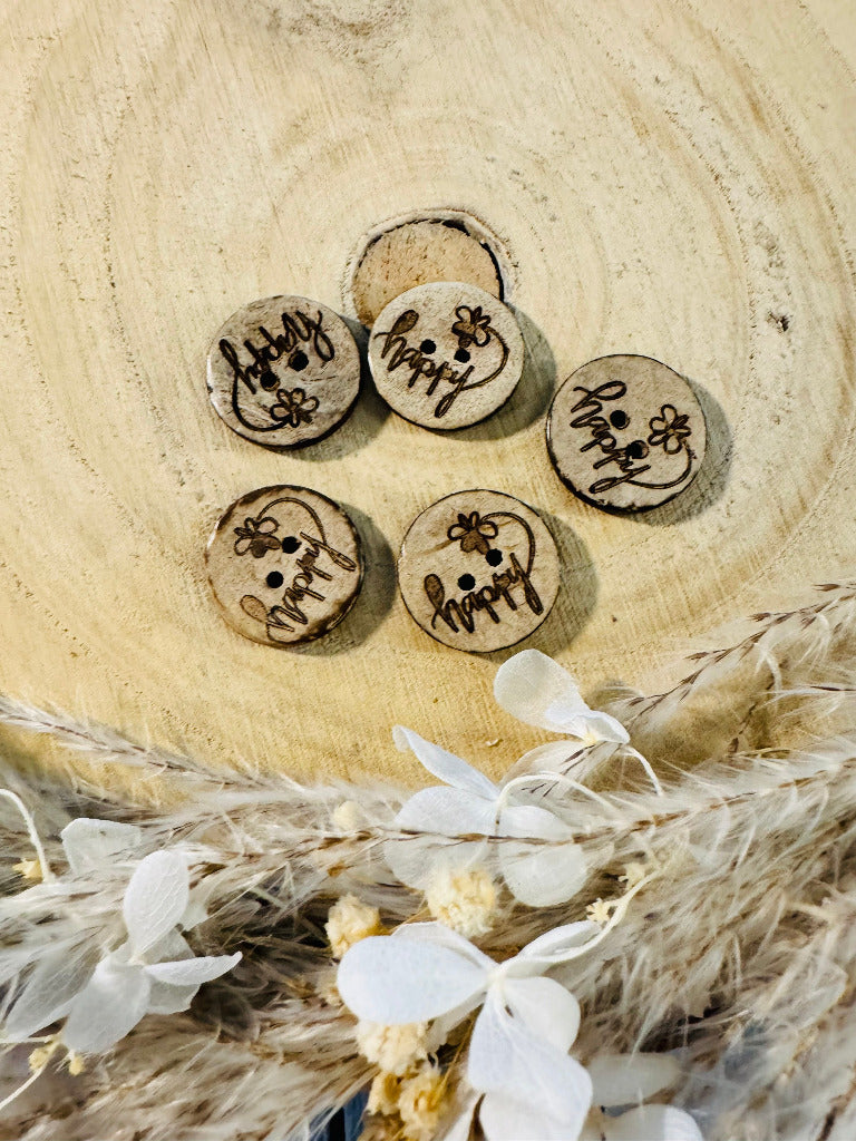 Kokosknopf rund mit dem Wort happy