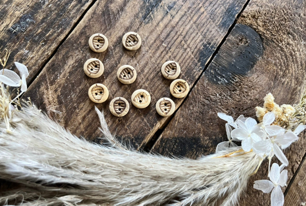 Kokosknopf mit einem Blatt abgebildet Durchmesser 12 mm