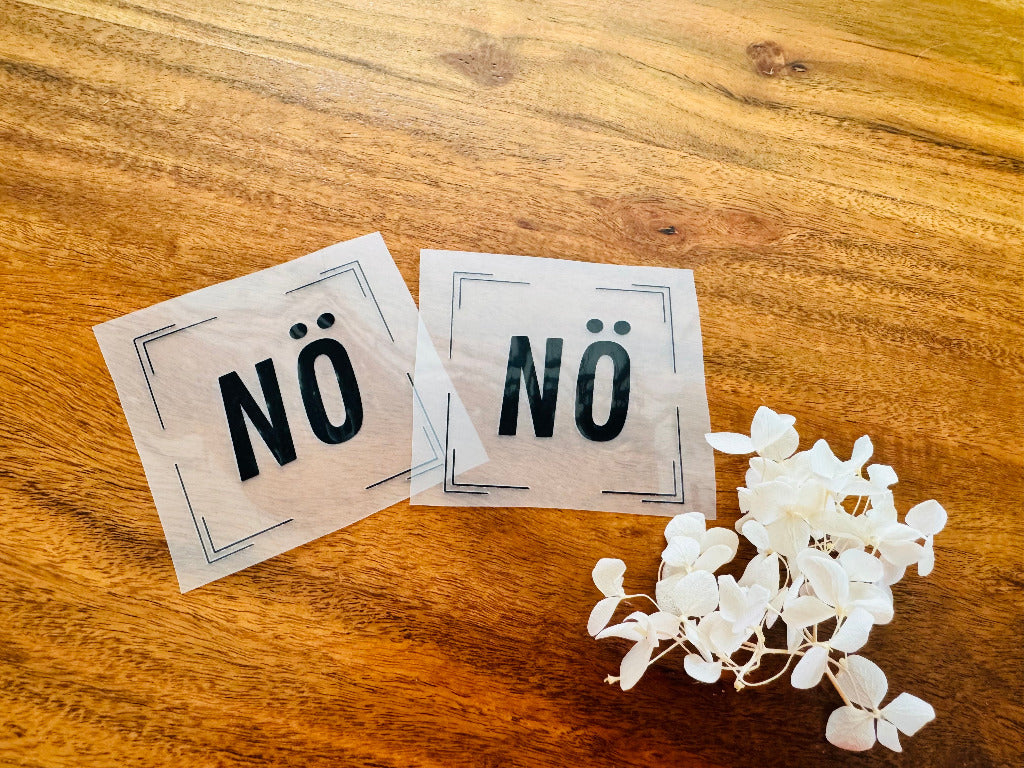 tolles Bügellabel mit dem Spruch NÖ in schwarzen Buchstaben