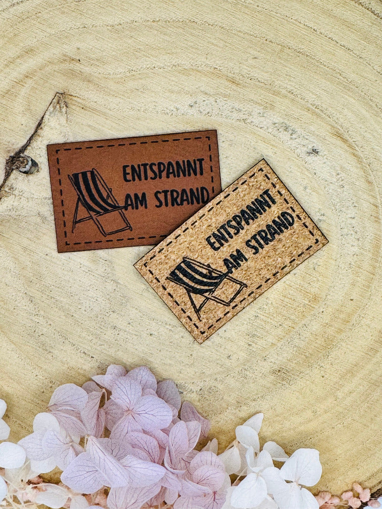 superweiches Kunstlederlabel Strand Motiv in zwei Farben abgebildet