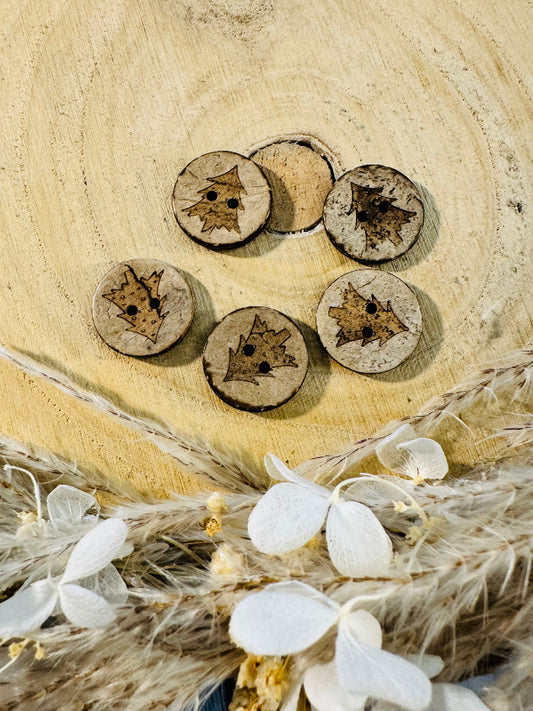 Kokosknopf rund mit einem Tannenbaum abgebildet