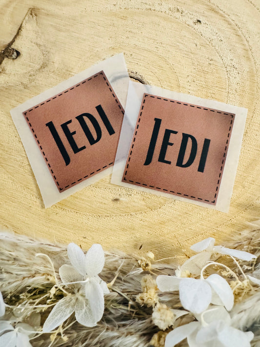 braunes Bügellabel mit dem Spruch JEDI in Schwarz