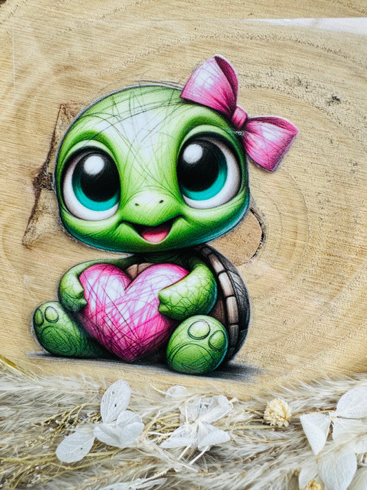 UV-Sticker mit einer kleinen niedlichen grünen Schildkröte mit einer roten Schleife am Kopf gezeichnet