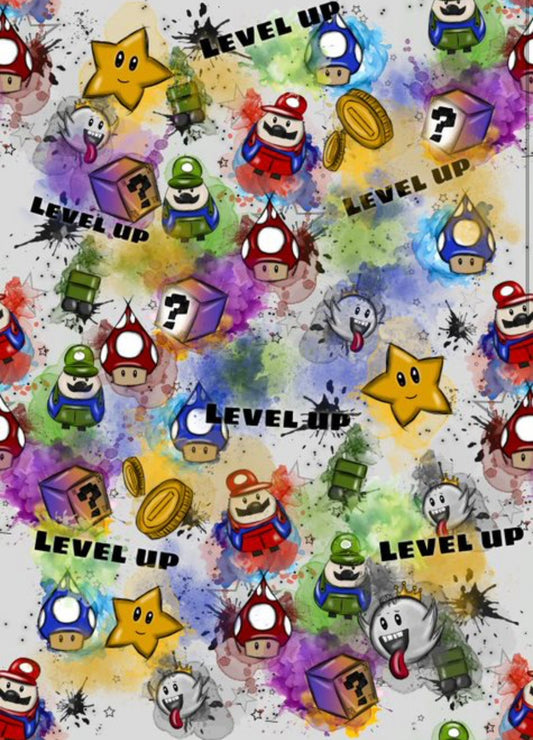 Stoff Tanelo mit kleinen Figuren in verschiedenen farben und Spruch Level up