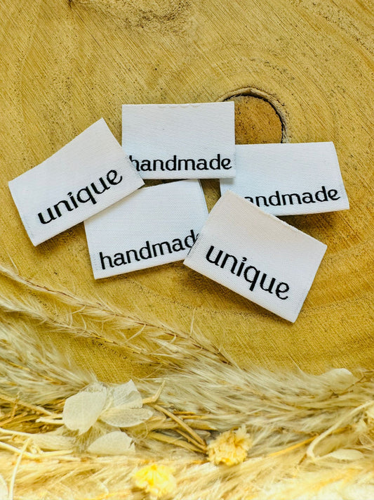 weisses Weblabel mit den Sprüchen Handmade und Unique auf je einer Seite