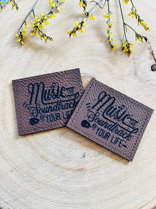 braunes PU-Label mit dem Spruch Music the soundtrack of your Life