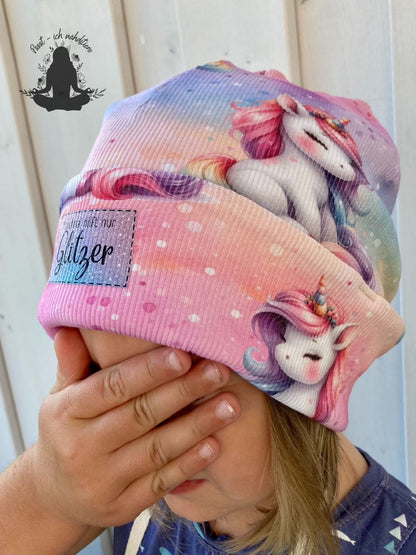 Stoff Einhorn sitzend