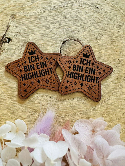 superweiches braunes Kunstleder Label in Sternform mit dem Spruch Ich bin ein Highlight