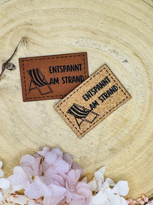 superweiches Kunstlederlabel Strand Motiv in zwei Farben abgebildet