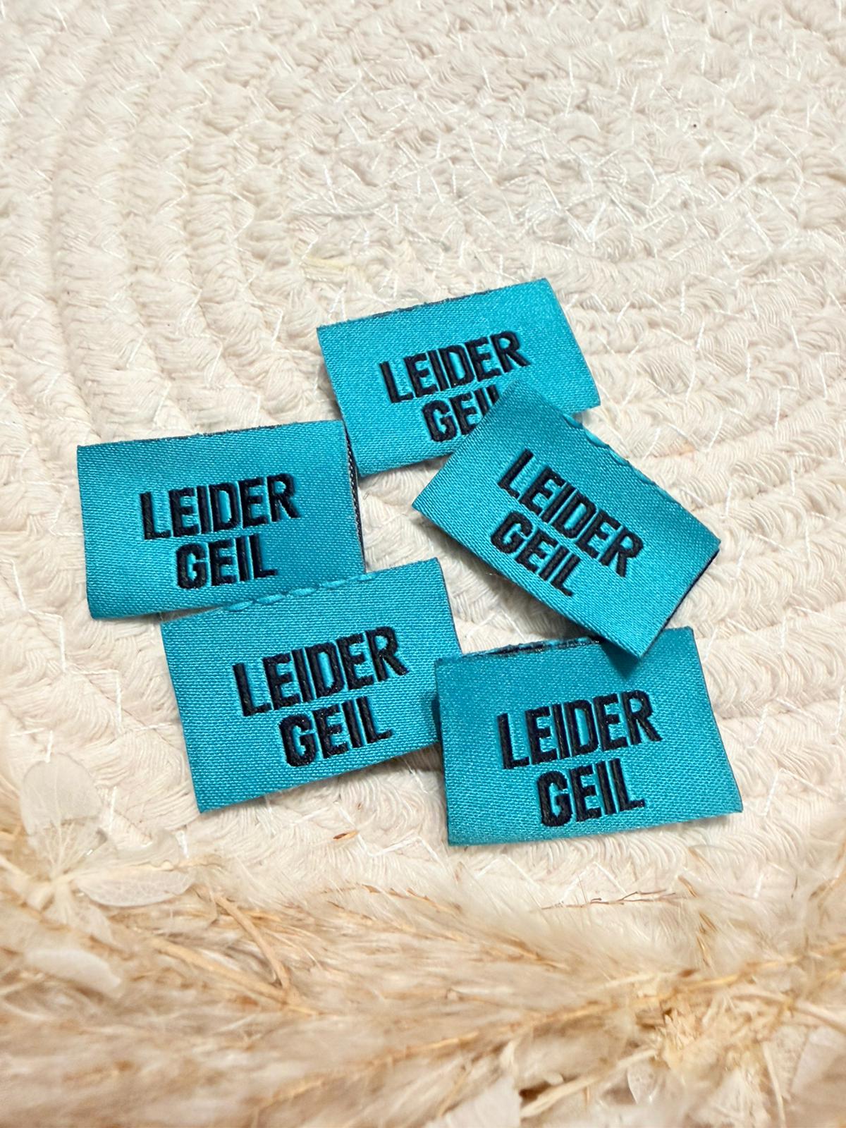 tolles tuerkisfarbenes Weblabel mit dem Spruch Leider Geil in schwarzen Buchstaben