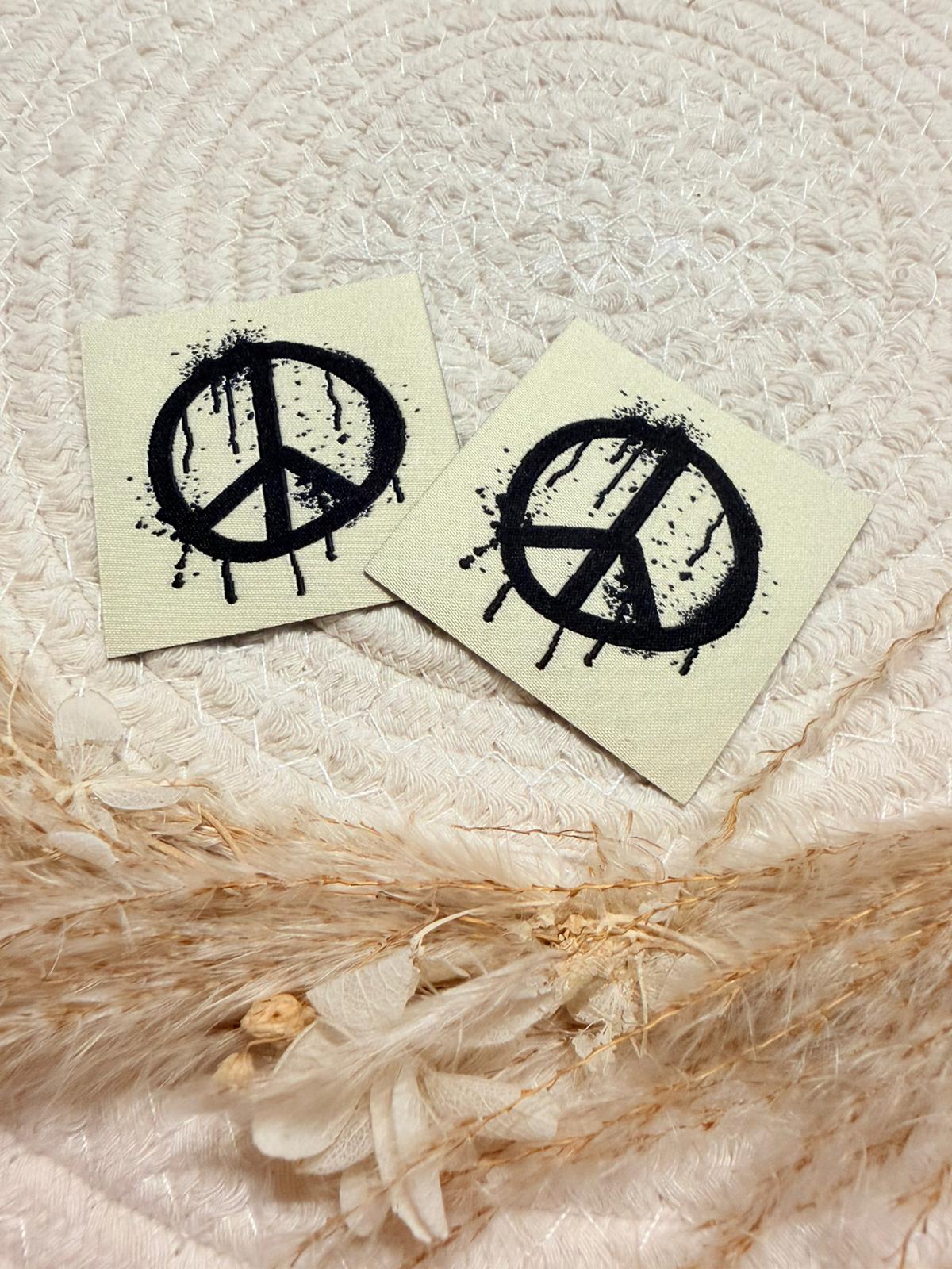 tolles beiges Baumwoll Label mit dem ikonischen Peace Zeichen